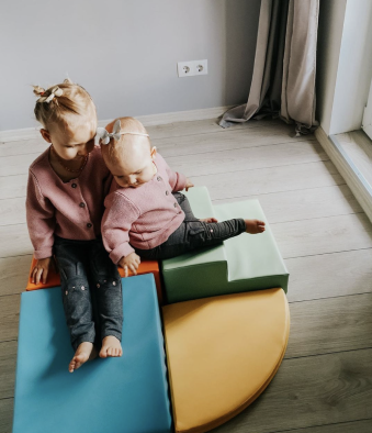 Two sisters playing with their IGLU foam block set