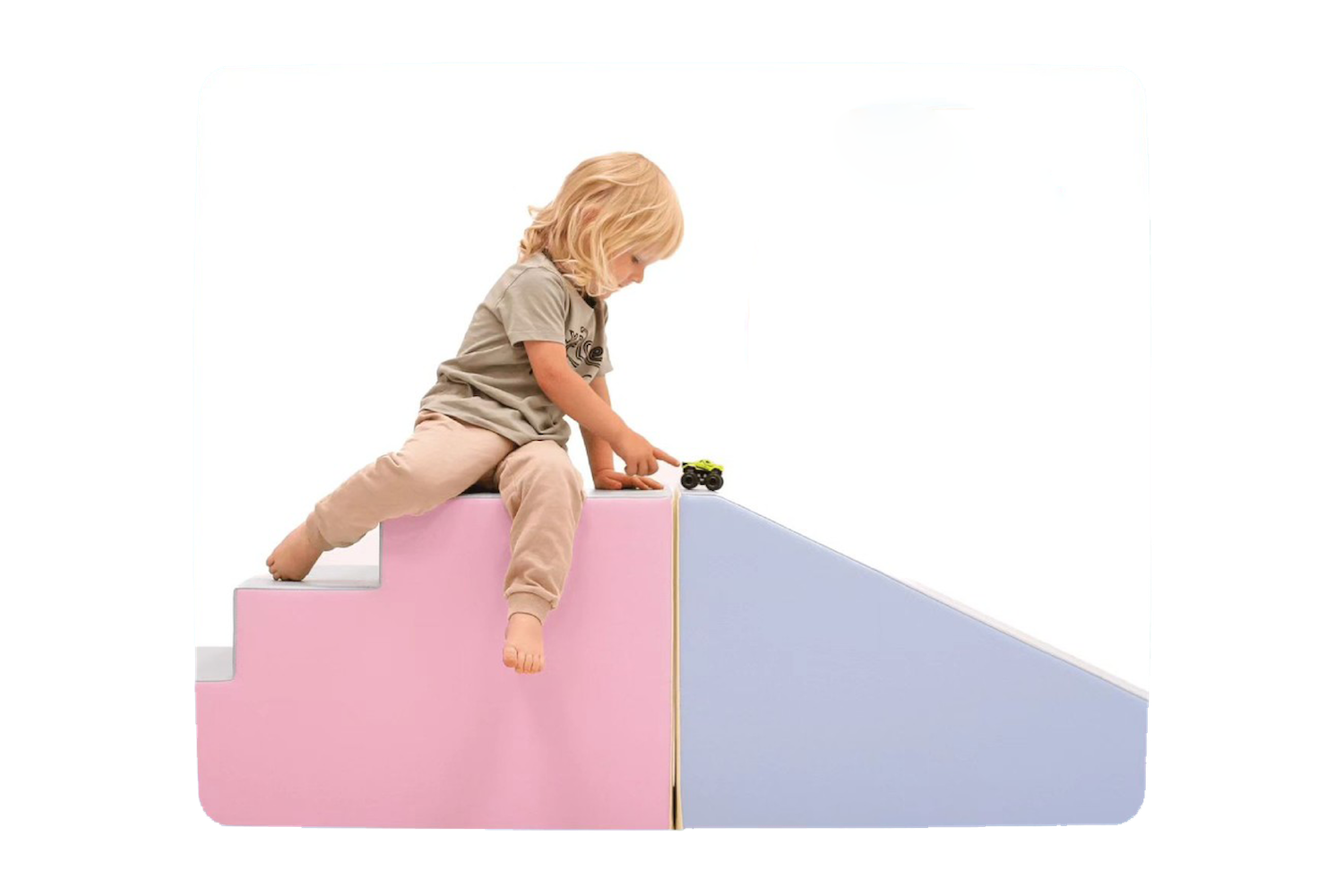 A child playing on a pastel pink and purple IGLU set