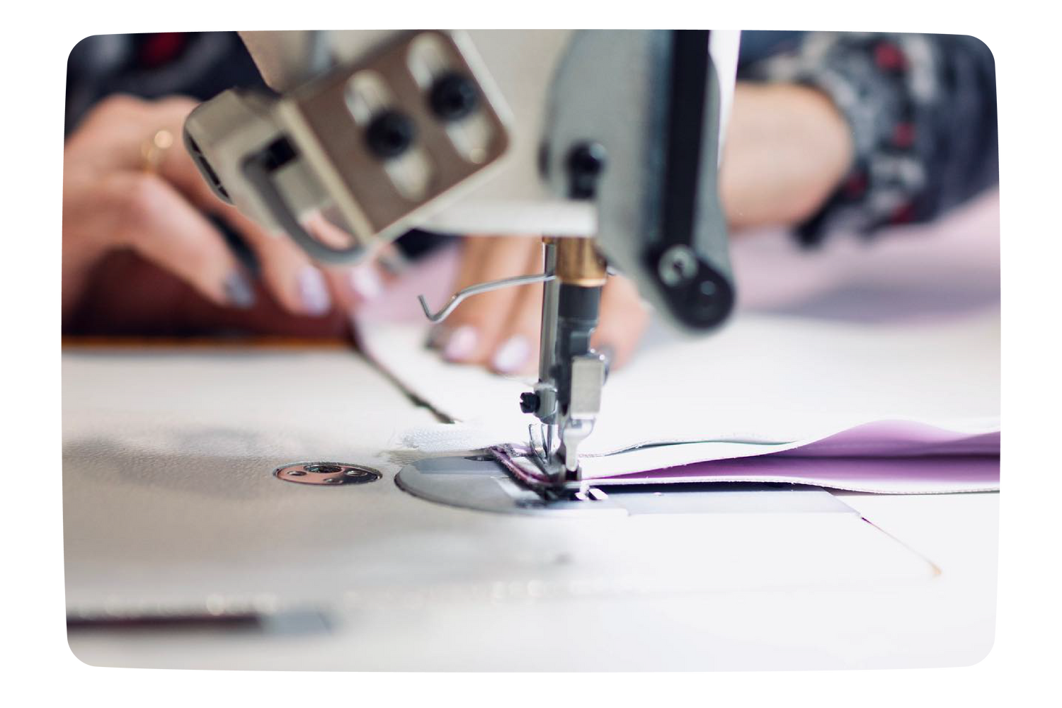 A woman sewing IGLU cover on a sewing machine