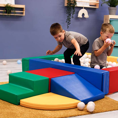 Two children having an IGLU Soft Play-inspired adventure with a Soft Play Set - Corner Crawler in a playroom.