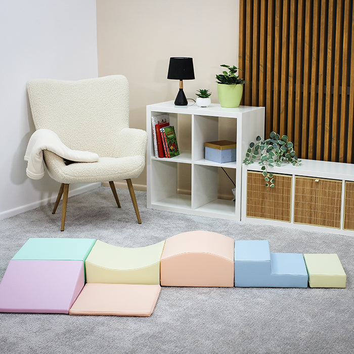 A Soft Play Set - Little Crawler featuring a room full of colorful foam blocks and a chair by IGLU Soft Play.