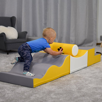 A baby is playing on the IGLU Soft Play - Advanced Wave Walk, developing coordination skills.
