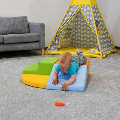 An IGLU Soft Play Corner Crawler is laying on a teepee in a living room.