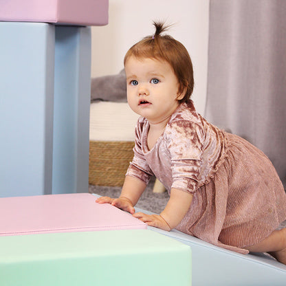 A baby girl is exploring the IGLU Soft Play Multifunctional Foam Play Set - Creativity.