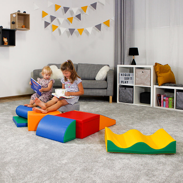 Two children engage in collaborative play with an IGLU Soft Play Soft Play Activity Set - Discoverer in a living room, promoting educational value.