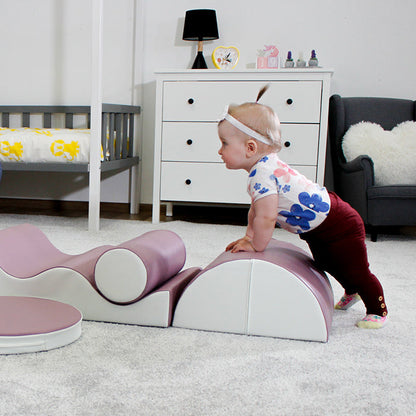 A baby is playing with an IGLU Soft Play Pathfinder playset toy in a room.